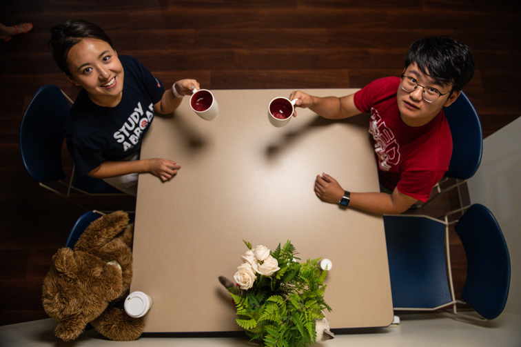 International Students Share a Drink In Campus Housing